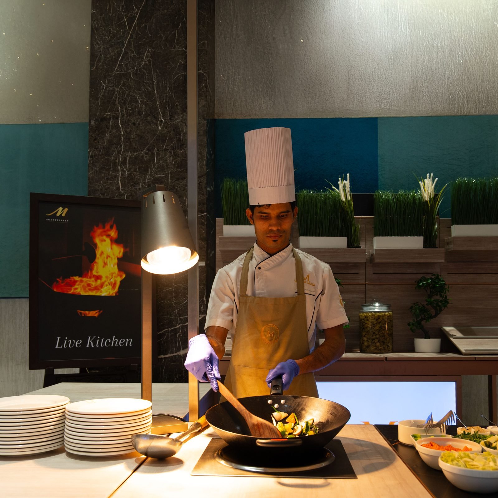 An M Hospitality chef at the live kitchen