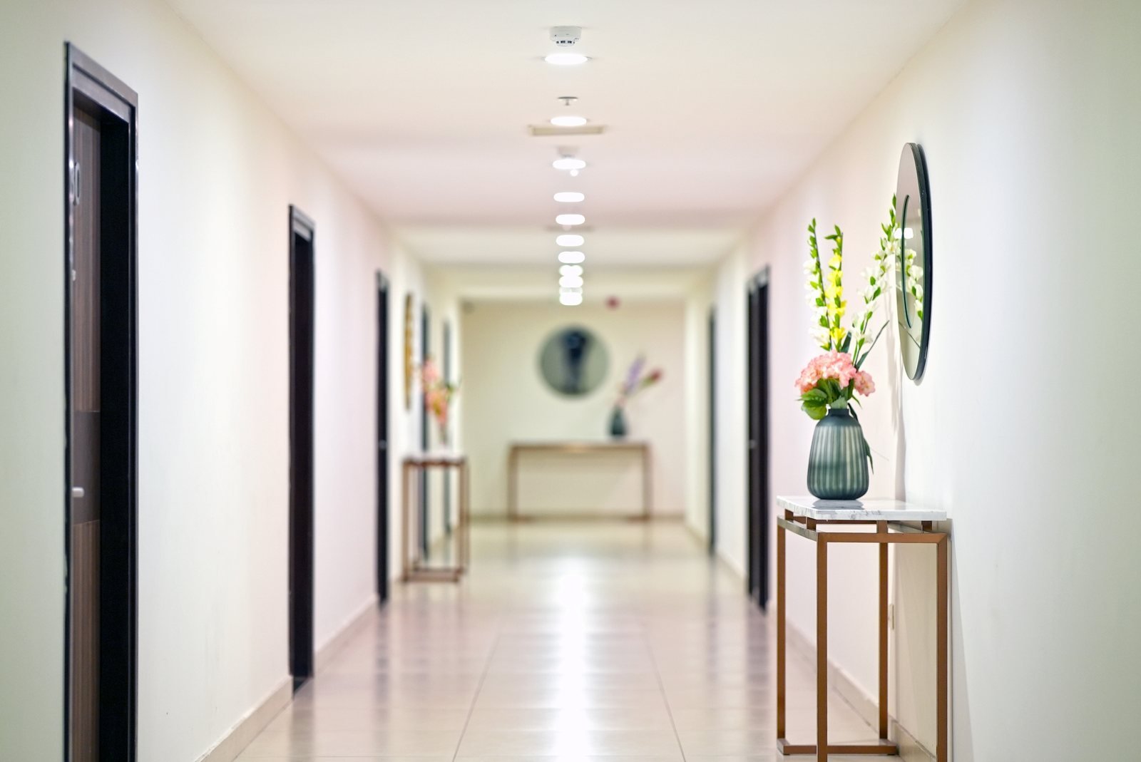 The corridor of guest rooms at Hotel M Stays, within the venue